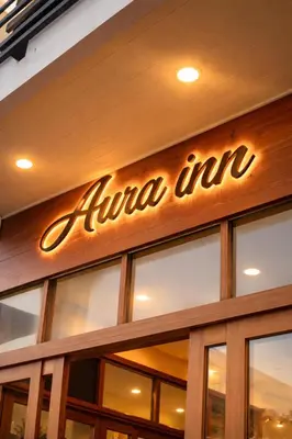 a sign on the front of a ninja inn at Aura Inn in Patong Beach
