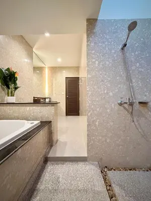 a bathroom with a shower and a sink and a tub at ozone pool villa phuket in Ban Pa Khlok