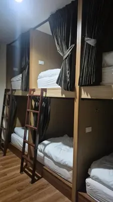 a group of bunk beds in a room at HOM's HOSTEL in Phuket Town