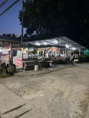 a gas station at night with a large canopy at Luxury Capsule Haus Phuket in Panwa Beach