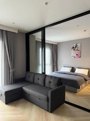 a bedroom with a bed and a couch at The Title Legendary swimming pool in Phuket