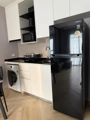 a kitchen with a black refrigerator and a dishwasher at The Title Legendary swimming pool in Phuket