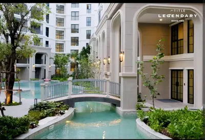 a walkway in the middle of a building at The Title Legendary swimming pool in Phuket