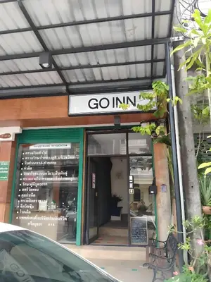 a store front with a sign that reads go inn at GO INN Phuket old Town in Ban Lo Long