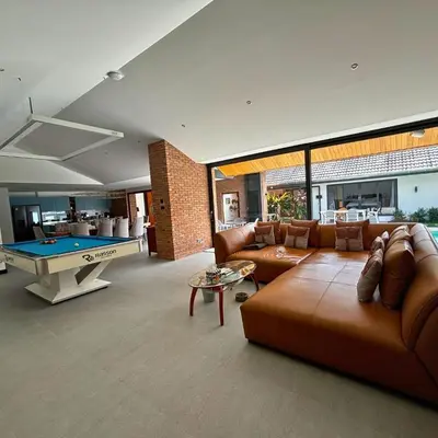 a living room with couches and a pool table at Golf Paradise 4 BR Smart Home Pool Villa at Loch Palm Golf Course Kathu in Ban Kathu