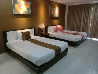 two beds in a hotel room with two beds at Bed & Bath in Kata Beach