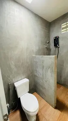 a bathroom with a white toilet in a room at House of Lee-Party room in Ban Huai Sai