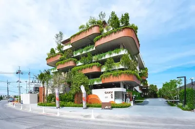a building with plants on the side of it at Casa tua, luxury 2bed - Canvas by Sansiri in Laguna Phuket