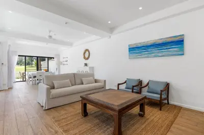 a living room with a couch and two chairs at Coastal Villa on Fairway 3 Bedroom in Laguna Phuket