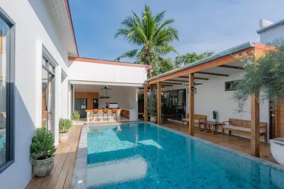 a swimming pool in the backyard of a house at Taraburi 6BR Pool Villa Phuket VVPHU91 in Thalang