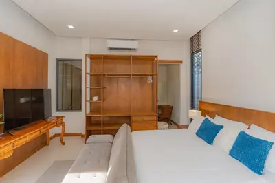 a living room with a bed and a television at Taraburi 6BR Pool Villa Phuket VVPHU91 in Thalang
