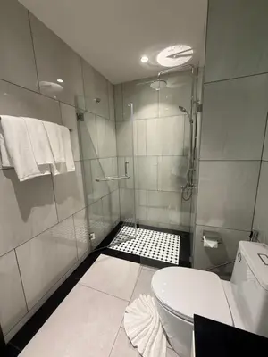 a bathroom with a shower and a toilet at Legendary D202 - The Title Legendary Bangtao Beach by UNO in Bang Tao Beach