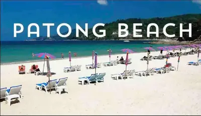 a beach with chairs and umbrellas and the words dancing beach at Beachfront 1 Deluxe BR Luxury Pool Patong Phuket in Patong Beach