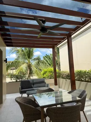 a patio with a ceiling fan and a table with chairs at Bella Home 2BR Pool Villa min to Bang Tao Beach in Ban Thalat Choeng Thale