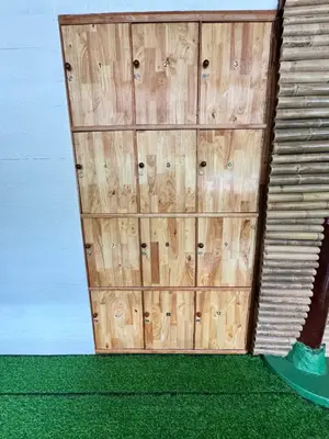 a wooden door on a building with green grass at The Tent Naiyang in Nai Yang Beach