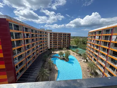 an aerial view of a hotel with a swimming pool at 777 Beach Condo in Ban Mai Salae
