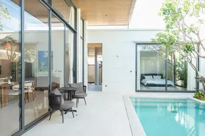 a house with a pool and a bedroom at Holiday pool villa in Ban Na Nai