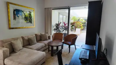 a living room with a couch and a table at Villa Samakee Luxury 5 Bedroom Villa in Ban Thalat Choeng Thale