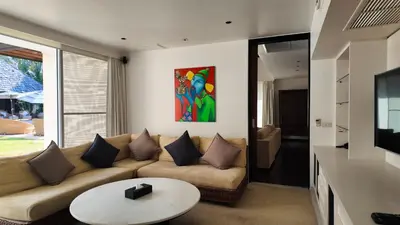a living room with a couch and a table at Villa Samakee Luxury 5 Bedroom Villa in Ban Thalat Choeng Thale