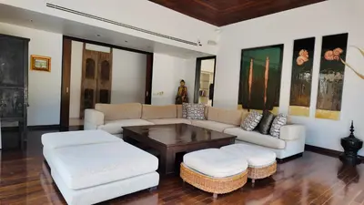 a living room with a couch and a coffee table at Villa Samakee Luxury 5 Bedroom Villa in Ban Thalat Choeng Thale