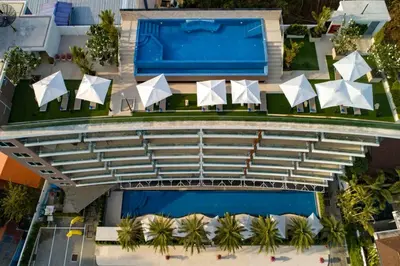 an aerial view of a resort with a swimming pool at 1 BR Balcony Pool and Garden View - Babylon Sky M206 in Rawai Beach