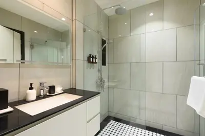 a bathroom with a sink and a shower at Bangtao Premium 2BR Apartment, Title Legendary B201 in Bang Tao Beach
