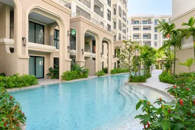 a swimming pool in the middle of a building at Bangtao Premium 2BR Apartment, Title Legendary B201 in Bang Tao Beach