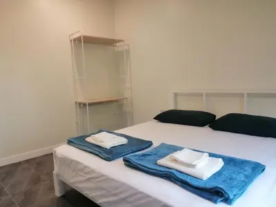 a bedroom with two towels sitting on a bed at TwinVillaSky in Ban Muang Mai