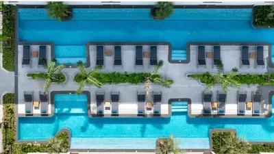 an overhead view of a building with a swimming pool at Kora Beachfront Apartments by Tropiclook in Layan Beach