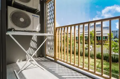 a room with a balcony with a air conditioner at 1BR Ozon BangTao apartment in Laguna Phuket