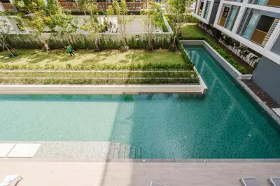 an overhead view of a swimming pool in a building at 1BR Ozon BangTao apartment in Laguna Phuket