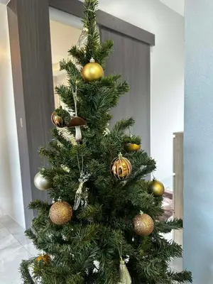 a christmas tree with gold ornaments on it at Kamala Zen house 2BR 15 min walk to beach in Kamala Beach