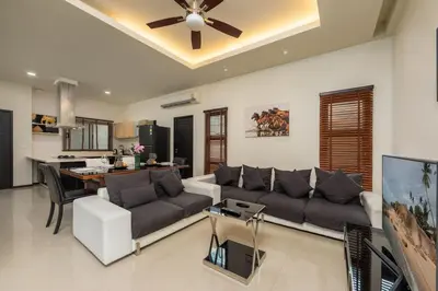 a living room with a couch and a ceiling fan at VILLA Kaheru Private Pool Near Nai Harn Beach in Nai Harn Beach