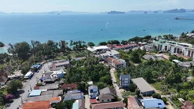 an aerial view of a town next to the water at Eid and Philippe's Home building A9 in Ban Ko Kwang