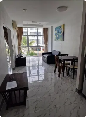 a living room with a couch and a table at Eid and Philippe's Home building A9 in Ban Ko Kwang