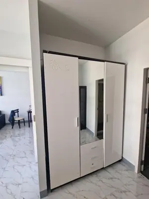 a large mirror in a room with a living room at Eid and Philippe's Home building A9 in Ban Ko Kwang