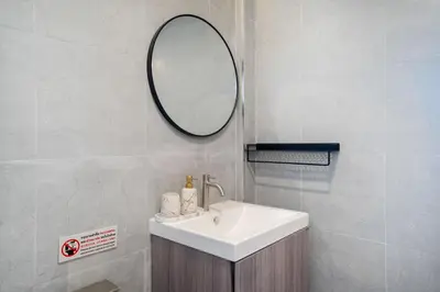 a bathroom with a sink and a mirror at Heaven pool villa reach beach in 3 mins bangla10m in Patong Beach