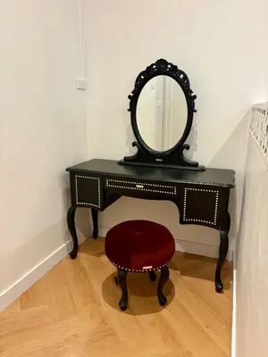 a black dressing table with a mirror and a stool at 3BR Family Villa - 1 km to Chalong Pier with WiFi in Chalong