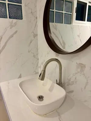 a white sink in a bathroom with a mirror at 3BR Family Villa - 1 km to Chalong Pier with WiFi in Chalong