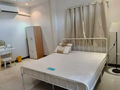 a hospital room with a bed and a desk at Joyful House3 in Thalang