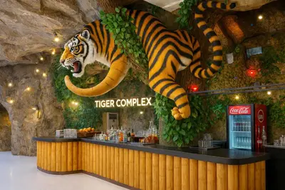 a tiger lobby with a tiger jumping over a counter at Tiger Complex Suites in Patong Beach