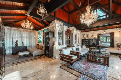 a large living room with a chandelier at Arun Rapee Villa Surin Beach in Surin Beach