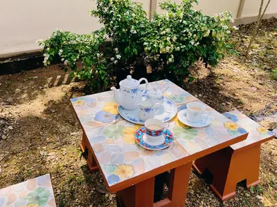 a table with a tea set on top of it at Latte Home Krabi ลาเต้โฮมกระบี่ in Ao Nang Beach
