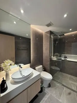 a bathroom with a sink and a toilet and a shower at Modern 1BR Condo Top Floor Pool, Cinema & Fast WiFi Next to Boat Avenue in Phuket