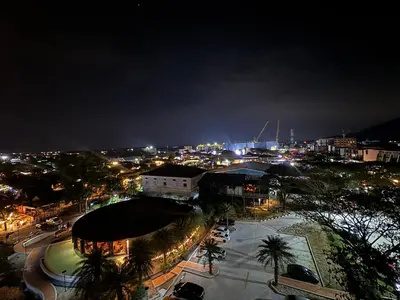 a city lit up at night with lights at Modern 1BR Condo Top Floor Pool, Cinema & Fast WiFi Next to Boat Avenue in Phuket