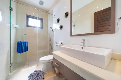 a bathroom with a sink and a toilet and a shower at 2 BR Pool Villa Isawan near Nai Harn in Ban Saiyuan (1)
