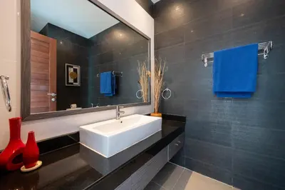 a bathroom with a white sink and a mirror at 2 BR Pool Villa Isawan near Nai Harn in Ban Saiyuan (1)