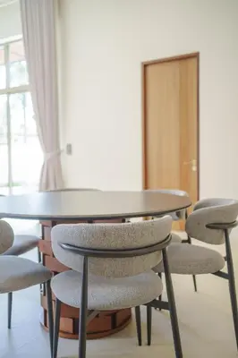 a group of tables and chairs in a room at New Celine Villa Private Pool Near Beaches in Ban Saiyuan (1)