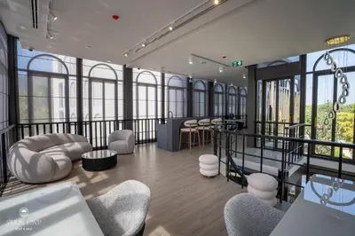 a rendering of a room with chairs and a bar at Harmony Condominium Phuket in Ban Saiyuan (1)