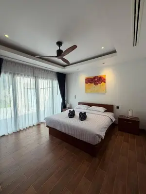 a bedroom with a bed and a ceiling fan at Harmony 3 Bedrooms Private Pool Villa in Laguna Phuket
